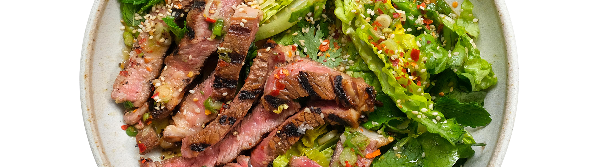 Rib Eye Steak with Crying Tiger Sauce and Sesame Baby Gem Salad